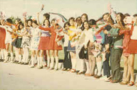Students greet President Nixon and First Lady Patricia Nixon at Tehran Mehrabad Airport