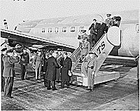 Photograph of President Truman shaking hands with the Shah of Iran upon the Shah's arrival at Washington National Airport., 11/16/1949  - ARC Identifier: 200141.