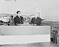 Photograph of the Shah of Iran speaking at Washington National Airport, during ceremonies welcoming him to the United States, as President Truman looks on., 11/16/1949 - ARC Identifier: 200143.