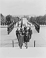 Photograph of the Shah of Iran, followed by a military procession, after laying a wreath at the Tomb of the Unknown Soldier at Arlington National Cemetery., ca. 11/16/1949 - ARC Identifier: 193606.
