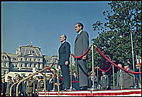 President Nixon and the Shah of Iran on the reviewing stand, on the south lawn of the White House, 10/21/1969 - ARC Identifier: 194300.
