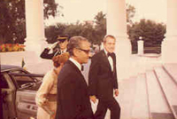 President Nixon greets the Shah of Iran and Empress Farah at the White House, 07/24/1973